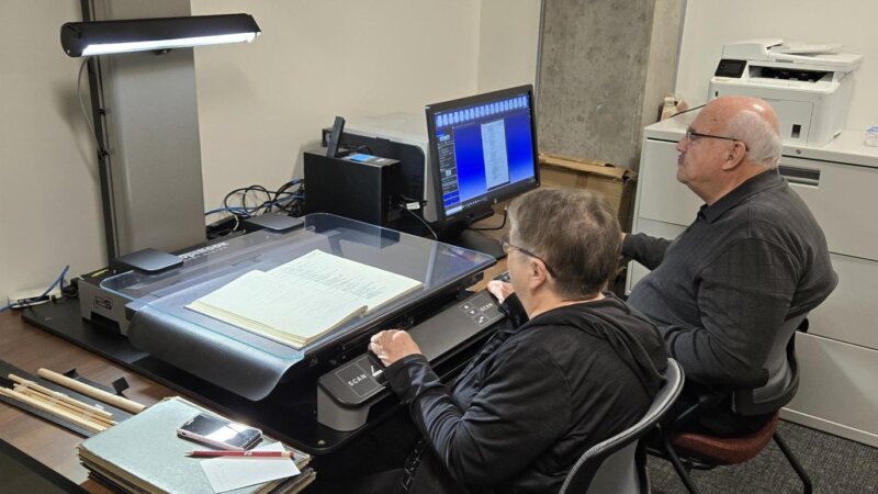 volunteers scanning documents to create digital copies