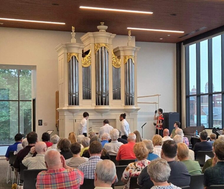 Phil Cooper performs on the History Center's Tannenberg Organ in June 2025.