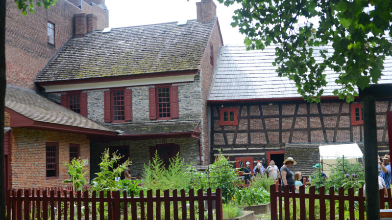 Photo showing the rear of the Gates House and Plough Tavern building and the courtyard garden behind them